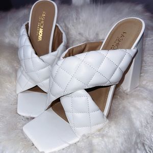 White chunky mule heels. Never worn. Comfortable